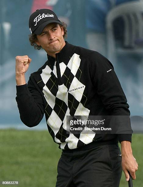 Adam Scott of Australia celebrates after sinking a birdie putt on the 18th hole to force a playoff during the final round of the EDS Byron Nelson...