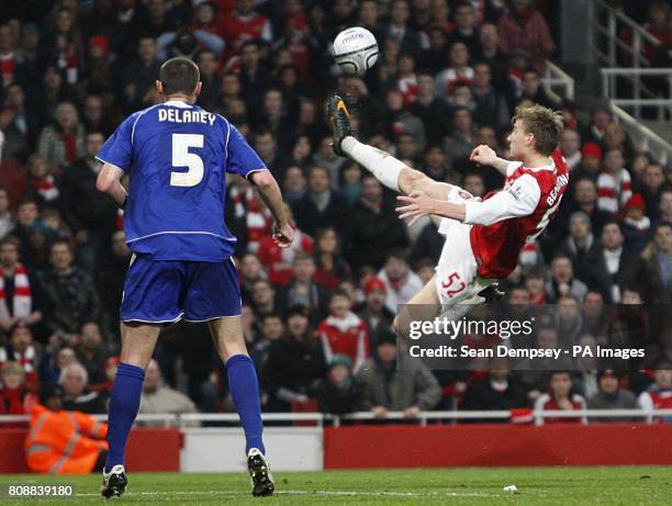 Arsenal's Nicklas Bendtner has an acrobatic shot on goal