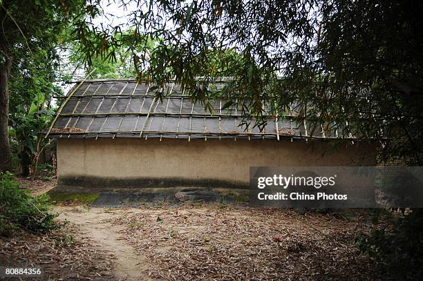 House built by mud and couch grass of farmer Huang Zhenshui sits in the sun in a village of Potou Township on April 21, 2008 in Zhanjiang of...