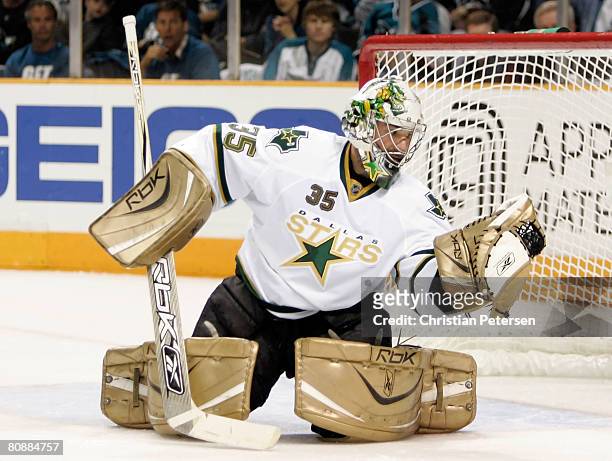 Goaltender Marty Turco of the Dallas Stars makes a glove save on the shot from the San Jose Sharks during Game 2 of the Western Conference Semifinals...
