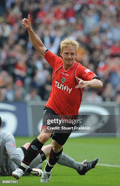 Mike Hanke of Hannover celebrates scoring his goal during the Bundesliga match between Hannover 96 and Hertha BSC Berlin at the AWD Arena on April...