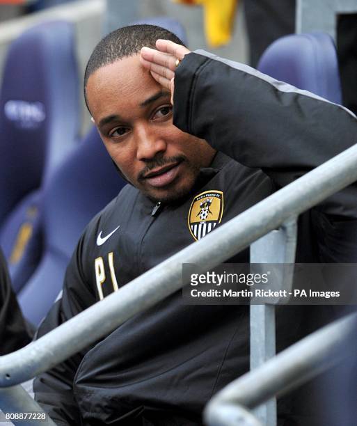 Notts County manager Paul Ince takes his seat near the touchline prior to kick-off