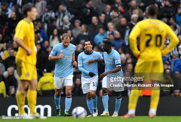 Manchester City's Carlos Tevez celebrates scoring his side's third goal of the game