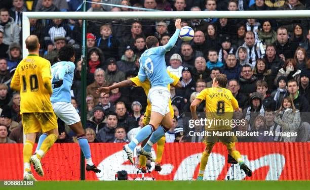 Manchester City's Edin Dzeko scores his side's fourth goal of the game