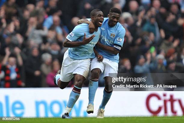 Manchester City's Micah Richards celebrates with team mate Kolo Toure after scoring his side's fifth goal of the game