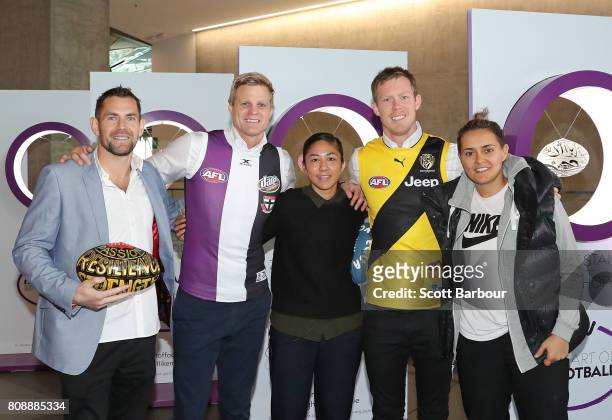 Art of Football' supporters Luke Hodge , Darcy Vescio and Moana Hope pose with Nick Riewoldt and Jack Riewoldt during the 'Art of Football'...