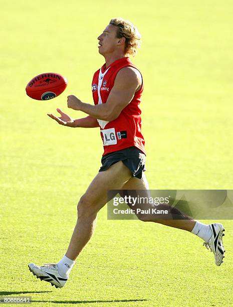 Shaun McManus of the Dockers handballs during an AFL Fremantle Dockers training session at Fremantle Oval on April 28, 2008 in Perth, Australia.