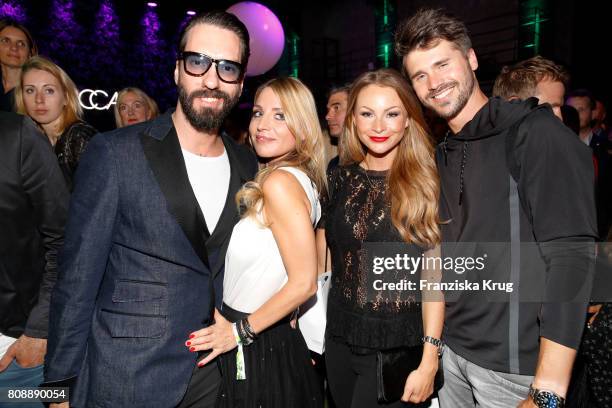 Alec Voelkel, member of the band The BossHoss, his wife Johanna Voelkel, Jana Julie Kilka and Thore Schoelermann attend the Marc Cain Fashion Show...