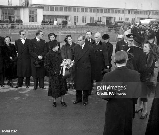 The Duke of Edinburgh and Earl Mountbatten at London Airport to greet King Gustaf Adolf and Queen Louise of Sweden when they arrived to attend the...