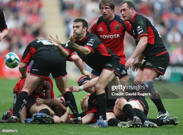 Neil De Kock of Saracens passes the ball away from a ruck during the Heineken Cup Semi Final match between Saracens and Munster at the Ricoh Arena on...