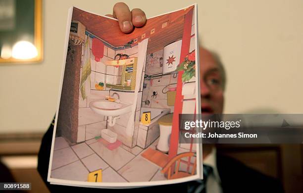 Colonel Franz Polzer, chief investigator of the district of Lower Austria shows a detail picture of the cellar appartement, where a father imprisoned...
