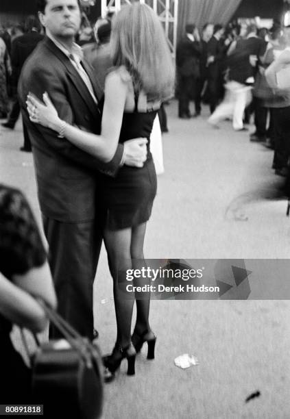 Couple dancing at a UniFrance party, promoters of French cinema worldwide, during Cannes Film Festival, on May 20, 1998 in Cannes, France.