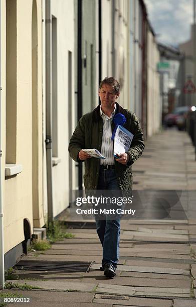 Mark Coote, Conservative Party parliamentary candidate for Cheltenham, delivers leaflets as part of his party's canvassing campaign ahead of local...