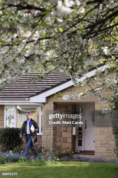 Mark Coote, Conservative Party parliamentary candidate for Cheltenham, delivers leaflets as part of his party's canvassing campaign ahead of local...