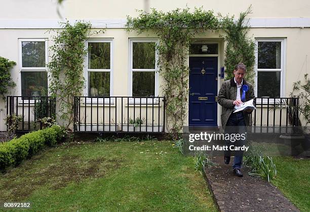 Mark Coote, Conservative Party parliamentary candidate for Cheltenham, delivers leaflets as part of his party's canvassing campaign ahead of local...