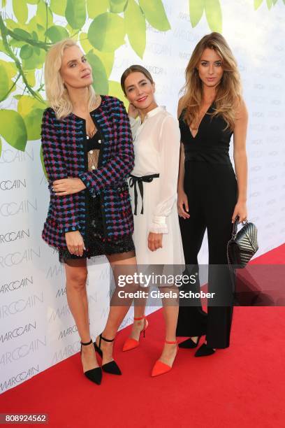 Joanna Horodynska, Kamilla Baar and Olesya Sudzilovskaya wearing a dress by Marc Cain the Marc Cain Fashion Show Spring/Summer 2018 at ewerk on July...