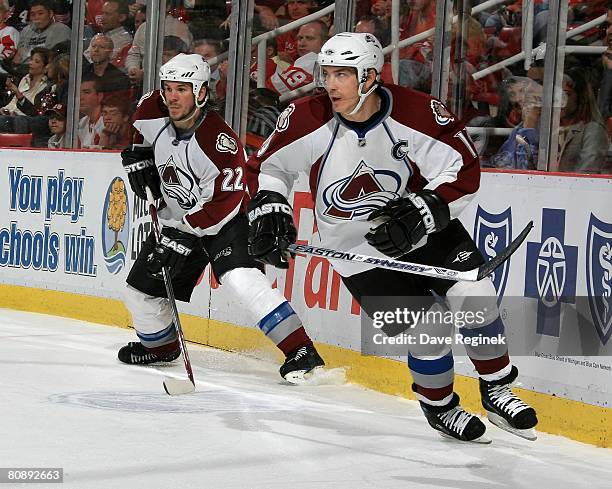 Scott Hannan and Joe Sakic of the Colorado Avalanche skate up-ice towards the Detroit Red Wings during game one of the Western Conference Semifinals...