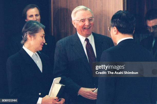 Communication Minister Takenori Kanzaki and U.S. Ambassador to Japan Walter Mondale are seen after their mobile phone negotiations on March 12, 1994...