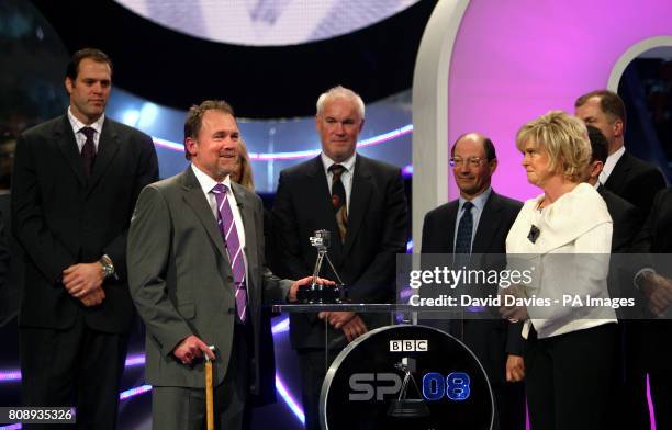 Presenter Sue Barker awards Alastair Hignell with the Helen Rollason Award during the BBC Sport Personality of the Year Awards at the Liverpool Echo...