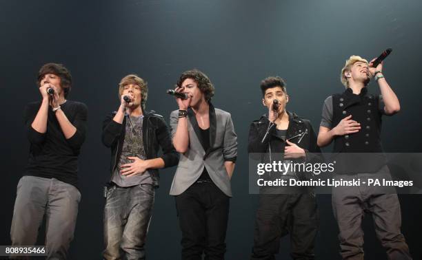 One Direction Louis Tomlinson, Liam Payne, Harry Styles, Zayn Malik and Niall Horan peform for the X Factor Live tour, at Wembley Arena, London.