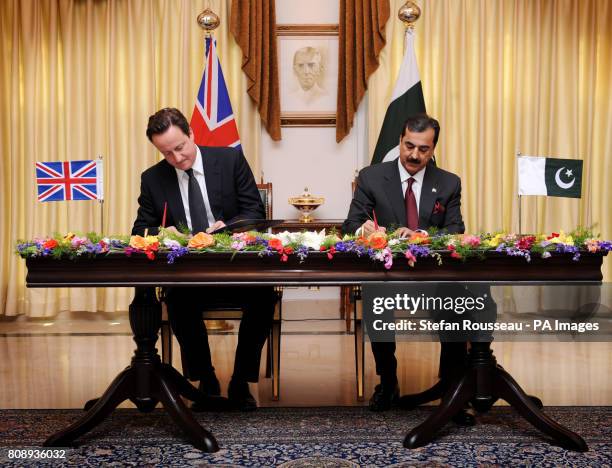 Prime Minister David Cameron signs an Enhanced Strategic Dialogue document between the UK and Pakistan with Pakistan Prime Minister Yusuf Raza Gilani...