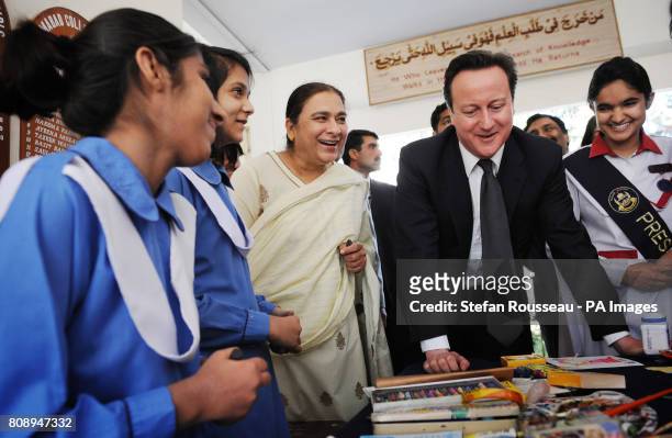 Prime Minister David Cameron meets pupils at Islamabad College for Girls in the Pakistan capital today where he later met with his Pakistani...