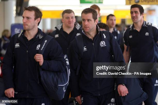 Scotland's Mike Blair and Chris Paterson arrive at Edinburgh Airport as the team prepare to depart for London.