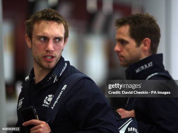 Scotland's Mike Blair and Chris Paterson arrive at Edinburgh Airport as the team prepare to depart for London.