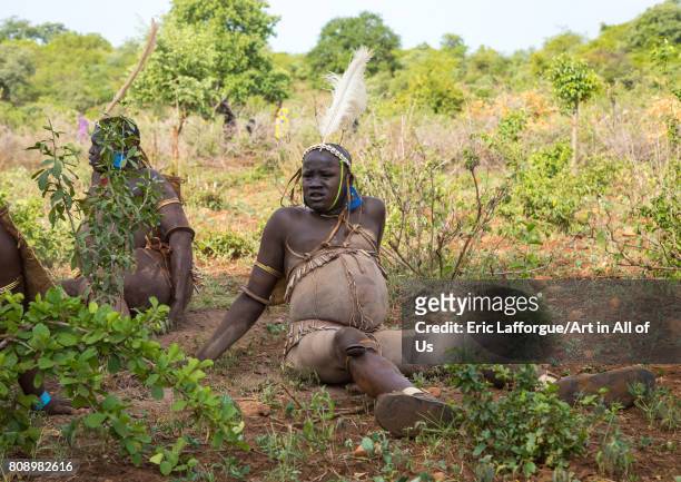 Bodi tribe fat men resting during Kael ceremony, Omo valley, Hana Mursi, Ethiopia on June 2, 2017 in Hana Mursi, Ethiopia.