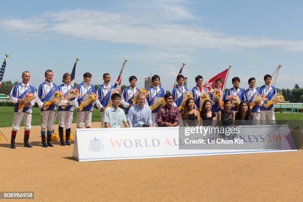 Jockeys smile for cameras at the World All-Star Jockeys opening ceremony at Sapporo Racecourse on August 29, 2015 in Sapporo, Hokkaido, Japan. The...