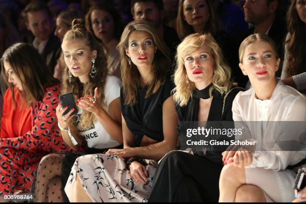 Victoria Swarovski, Marvy Rieder, Olesya Sudzilovskaya and Kamilla Baar sit front row during the Marc Cain Fashion Show Spring/Summer 2018 at ewerk...