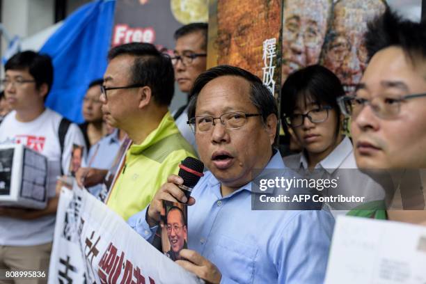 Veteran activist Albert Ho speaks as he prepares to post a card to terminally-ill Chinese Nobel laureate Liu Xiaobo outside the General Post Office...