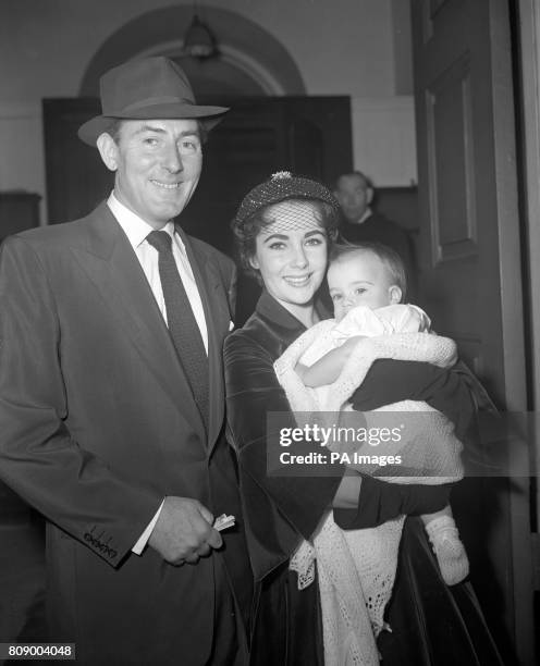 Baby Michael Howard Wilding with his film star parents Michael Wilding and Elizabeth Taylor, after he had been christened at the Grosvenor Chapel,...