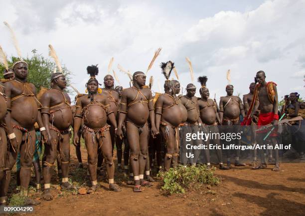 Bodi tribe fat men during Kael ceremony, Omo valley, Hana Mursi, Ethiopia on June 2, 2017 in Hana Mursi, Ethiopia.