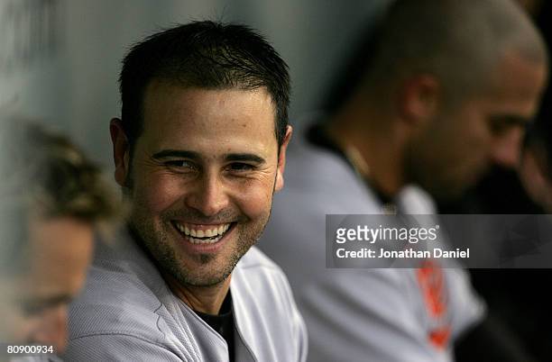 Ramon Hernandez of the Baltimore Orioles smiles in the dugout after he hit a home run to give the Orioles a 3-2 lead in the top of the eleventh...