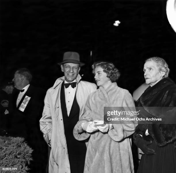 Dancer, actor and singer Fred Astaire attends the premiere of "Sayonara" with his mother Johanna and daughter Ava on December 6, 1957 in Los Angeles,...