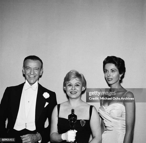 Dancer, actor and singer Fred Astaire with actress Dana Wynter presents the Oscar for best Foreign Film to actress Giulietta Masina star of the movie...