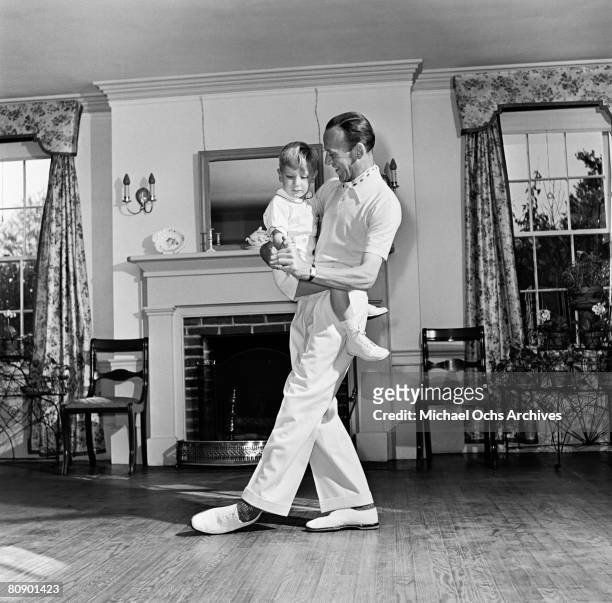 Dancer, actor and singer Fred Astaire performs for the camera with his son Fred Jr. During a photo session circa 1940 in Los Angeles, California.