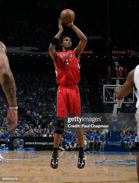 Chris Bosh of the Toronto Raptors shoots against the Orlando Magic in Game Five of the Eastern Conference Quarterfinals during the 2008 NBA Playoffs...