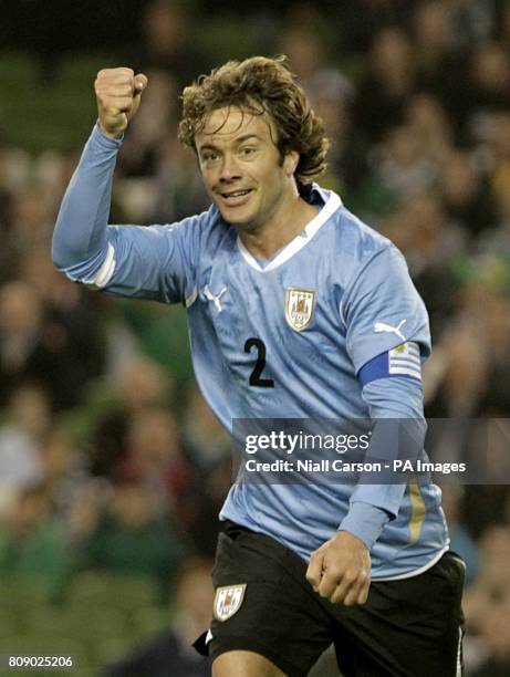 Uruguay's Diego Lugano celebrates after scoring his team's opening goal.