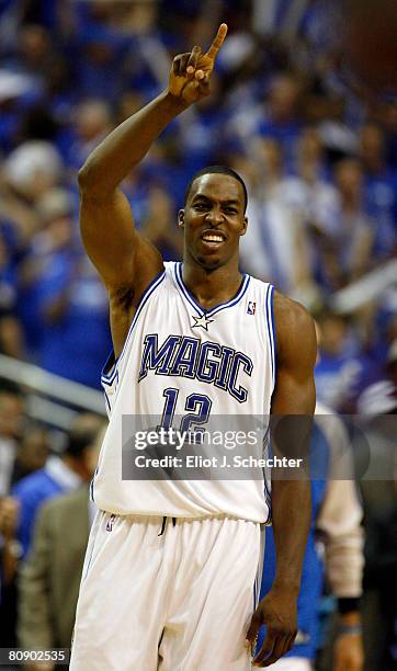 Dwight Howard of the Orlando Magic celebrates their 102-92 win against the Toronto Raptors in Game Five of the Eastern Conference Quarterfinals...