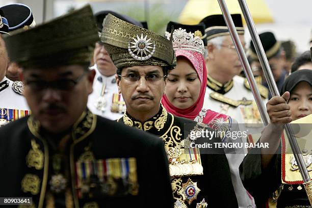 Malaysia's King, Tuanku Mizan Zainal Abidin and Queen Nur Zahirah enter the Parliament building after inspecting the Royal Malay Regiment Guard of...