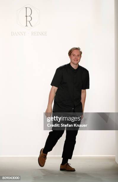 Designer Danny Reinke acknowledges the applause of the audience at the Danny Reinke show during the Mercedes-Benz Fashion Week Berlin Spring/Summer...