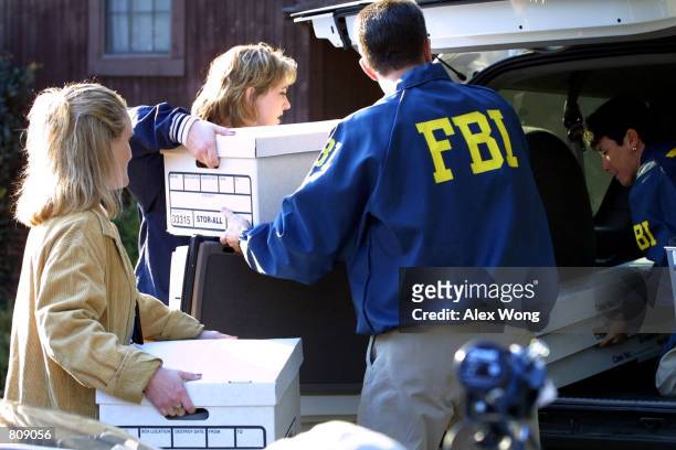 Agents remove evidence from the home of FBI agent Robert Philip Hanssen February 20, 2001 in Vienna, Va. Veteran FBI agent Robert Philip Hanssen has...
