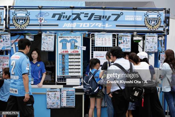 Fans check the official marchandise stalls prior to the J.League J1 match between Kawasaki Frontale and Urawa Redi Diamonds at Todoroki Stadium on...