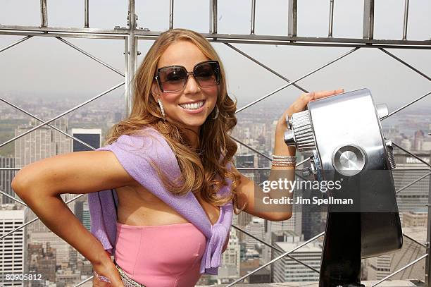 Mariah Carey lights up the Empire State Building to celebrate her new album "E=MC2" on April 25, 2008 in New York City.