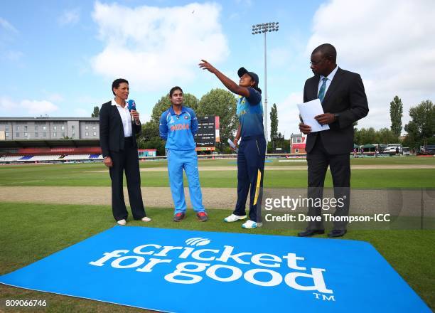 Inoka Ranaweera of Sri Lanka tosses the coin alongside Mithali Raj of India during the ICC Women's World Cup match between Sri Lanka and India at The...