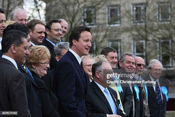 Leader of the Conservative party David Cameron poses with all the tory candidates as he receives a cheque on the steps of Bolton Town Hall on April...