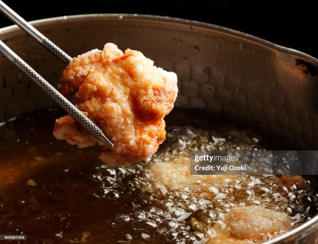 Japanese fried chicken Karaage being lifted