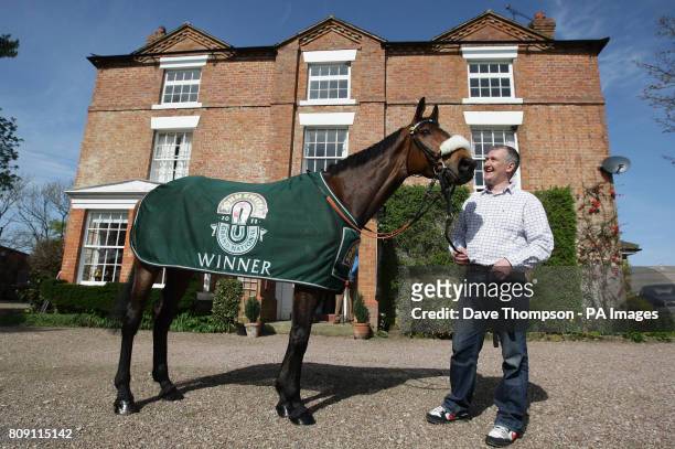 Trainer Donald McCain Jnr stands alongside Grand National winner Ballabriggs during a Homecoming Photocall at the stables in Malpas, Cheshire, PRESS...